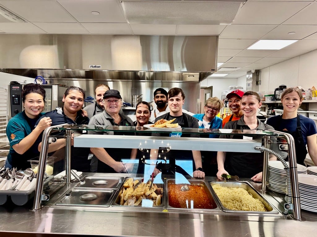MNC team preparing and serving meals at Ronald McDonald House Charities Alberta.