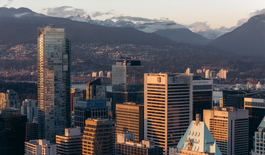 Downtown city skyline with sprawling suburbs in the backgound