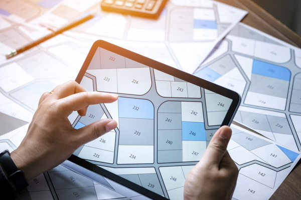 Close-up of parcel boundary map on tablet supporting cadastral data review